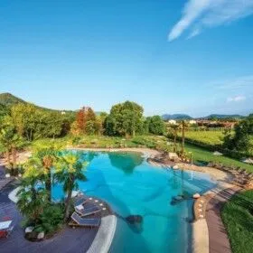 Beautiful outdoor pool with lounge chairs and lush greenery in Long Island.