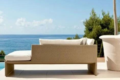 Elegant outdoor lounge with ocean backdrop, perfect for relaxing and outdoor living on Long Island. Modern outdoor lounge with ocean view and outdoor furnishings.