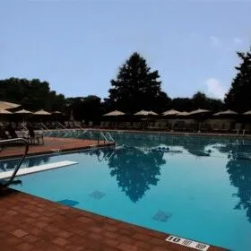 Beautiful inground pool with outdoor furnishings on Long Island.