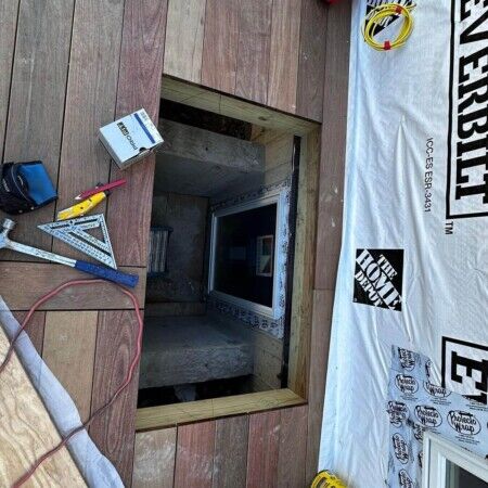 Preparing for inground pool installation with tools and materials on site. Construction site with pool opening and tools for inground pool installation.