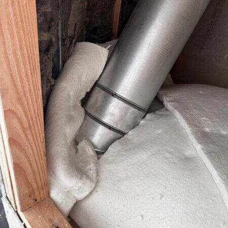Close-up of insulation and piping during inground pool construction in Oyster Bay. Insulation and piping for inground pool installation in backyard.