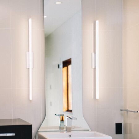Contemporary bathroom mirror with integrated vertical LED lights.