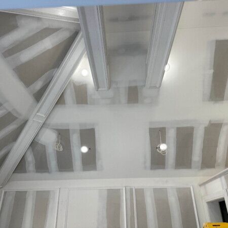 Interior ceiling framing and drywall installation in progress at Manhasset cabana.