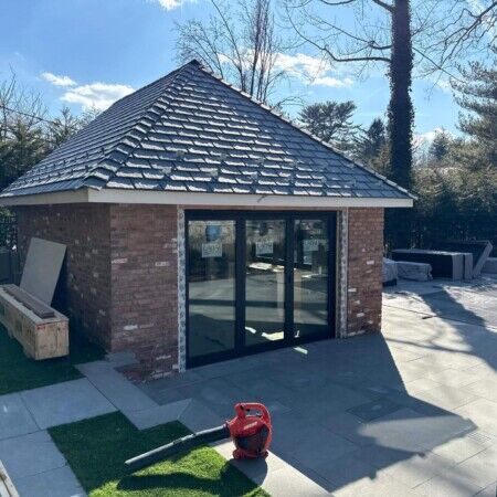New cabana with brick exterior and glass doors in Manhasset, Long Island.