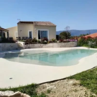 Beautiful inground pool installed by All Island Group in Long Island with outdoor furnishings and scenic views. Inground pool with modern backyard design in Long Island.