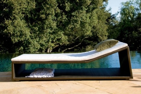 Stylish outdoor lounge chair with cushion, perfect for relaxing by the pool or in the backyard. Modern outdoor lounge chair with cushion by the poolside.