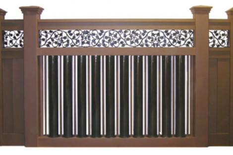 Stylish iron fence with detailed scrollwork enhances outdoor privacy and security. Elegant iron fence with intricate scrollwork and vertical bars for outdoor security.