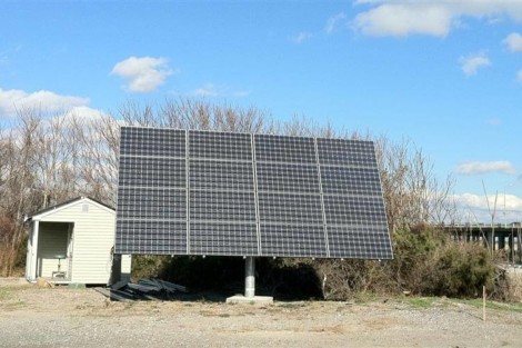 A large solar panel array set up outdoors in Long Island to harness solar energy for sustainable power. Large solar panel array installed outdoors in Long Island for renewable energy.