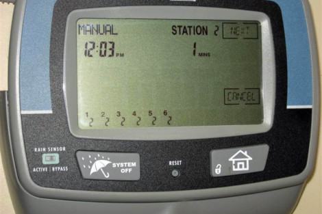 Irrigation controller used for managing outdoor watering schedules on Long Island properties. Irrigation system controller with digital display and settings.