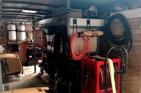 Pool equipment, hoses, and outdoor furnishings organized in a garage for easy access. Pool equipment and outdoor furnishings stored in a garage.