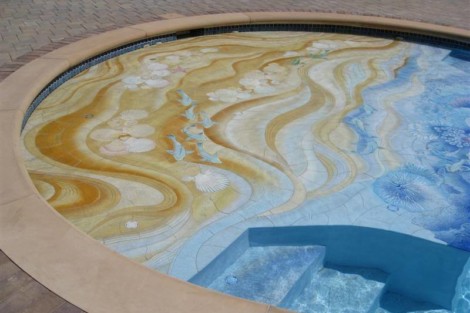 A beautifully designed custom tile pool featuring artistic patterns and vibrant colors, perfect for outdoor luxury spaces. Decorative custom tile pool with intricate patterns and vibrant colors.