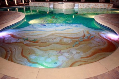 Elegant custom tile pool with mosaic artwork, perfect for outdoor luxury living in Long Island. Colorful custom tile pool with intricate mosaic design in Long Island.